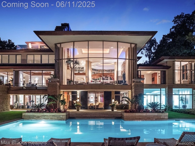 4790 Dow Ridge Rd, Orchard Lake, MI 48324 - back of property featuring an outdoor pool and a balcony