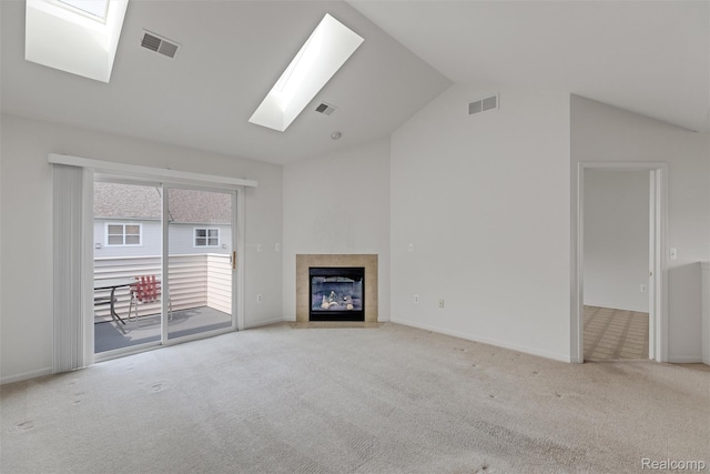 612 Riverstone Ln Unit 75, Chelsea, MI 48118 - unfurnished living room with a skylight, lofted ceiling, carpet floors, a fireplace, and baseboards