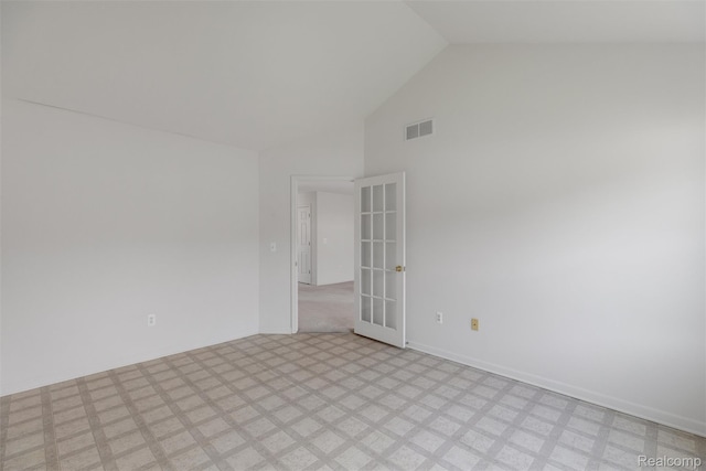 612 Riverstone Ln Unit 75, Chelsea, MI 48118 - unfurnished room featuring high vaulted ceiling, french doors, and light flooring
