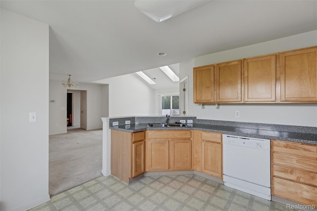 612 Riverstone Ln Unit 75, Chelsea, MI 48118 - kitchen with dishwasher, a sink, light floors, a peninsula, and a skylight