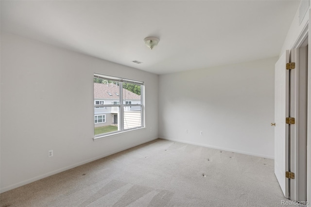 612 Riverstone Ln Unit 75, Chelsea, MI 48118 - unfurnished room featuring light colored carpet and baseboards