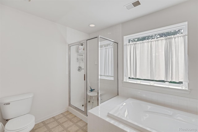 612 Riverstone Ln Unit 75, Chelsea, MI 48118 - full bathroom featuring a bath, tile patterned floors, a shower stall, and toilet