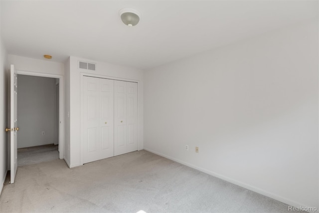 612 Riverstone Ln Unit 75, Chelsea, MI 48118 - unfurnished bedroom with carpet floors, a closet, and baseboards