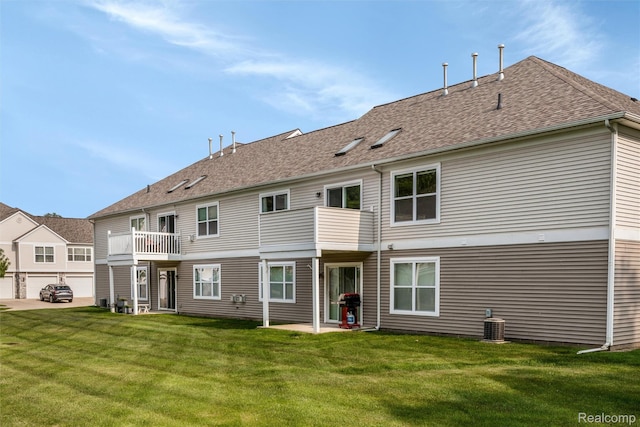 612 Riverstone Ln Unit 75, Chelsea, MI 48118 - back of house featuring a balcony, a yard, and roof with shingles