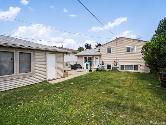 9636 Mueller St, Taylor, MI 48180 - back of house with a patio and a lawn