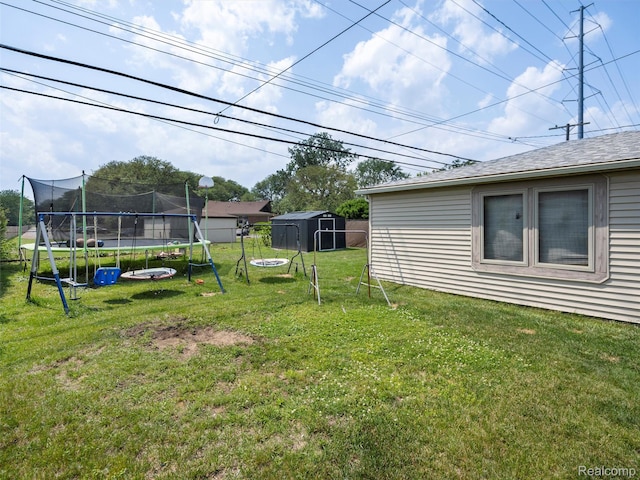 9636 Mueller St, Taylor, MI 48180 - view of grassy yard featuring a trampoline and a storage unit