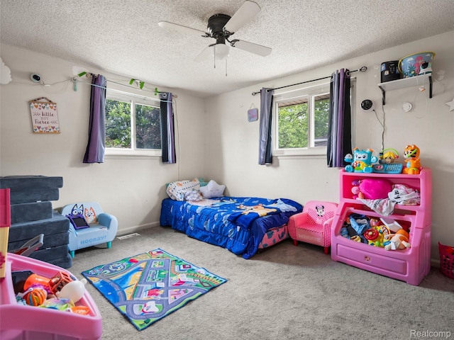 9636 Mueller St, Taylor, MI 48180 - carpeted bedroom with multiple windows, a textured ceiling, and ceiling fan