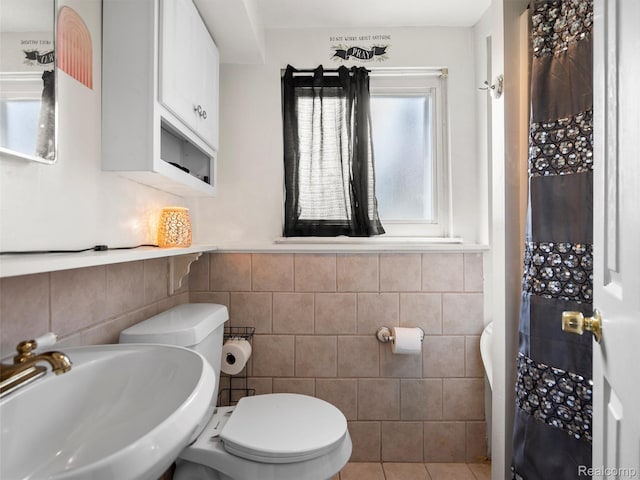 9636 Mueller St, Taylor, MI 48180 - full bathroom with tile walls, a wainscoted wall, and a shower with shower curtain