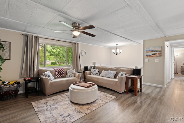 311 Marion St, Clinton, MI 49236 - living room featuring wood finished floors, a ceiling fan, a chandelier, and baseboards