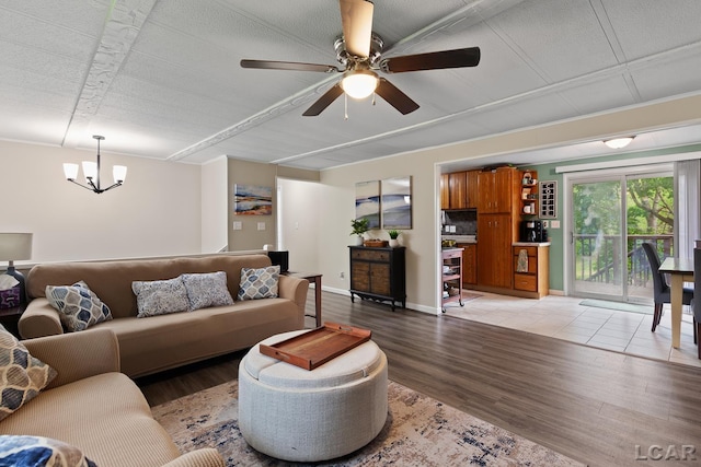311 Marion St, Clinton, MI 49236 - living room featuring light wood-style flooring, a chandelier, and a ceiling fan