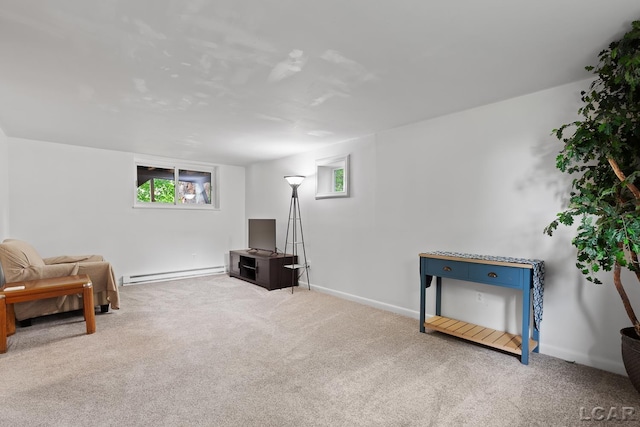 311 Marion St, Clinton, MI 49236 - living area featuring a baseboard heating unit, carpet, and baseboards