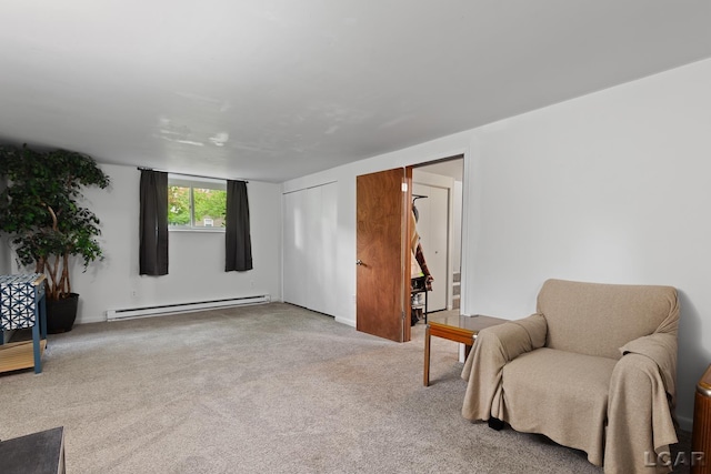 311 Marion St, Clinton, MI 49236 - living area featuring a baseboard heating unit and carpet floors