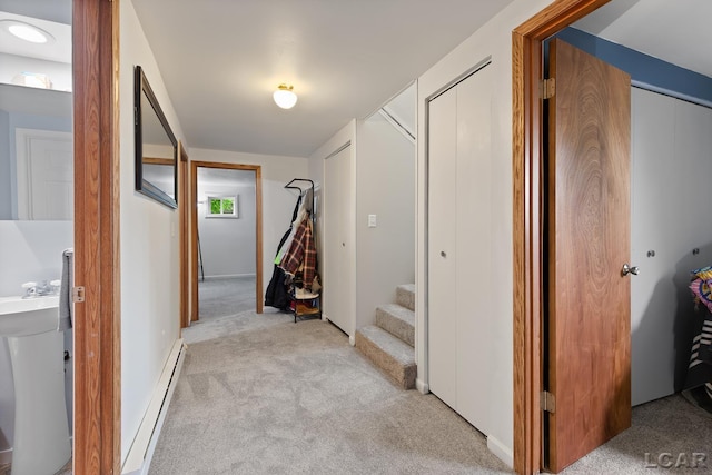 311 Marion St, Clinton, MI 49236 - corridor featuring light carpet and a baseboard heating unit