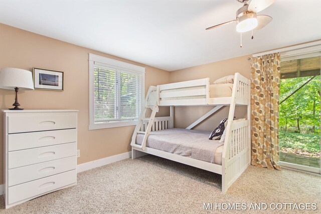 2338 Crescent Walk, Macatawa, MI 49434 - carpeted bedroom featuring baseboards and a ceiling fan