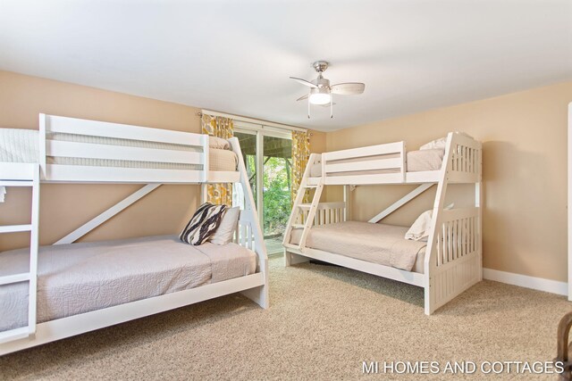 2338 Crescent Walk, Macatawa, MI 49434 - carpeted bedroom featuring access to outside, baseboards, and ceiling fan