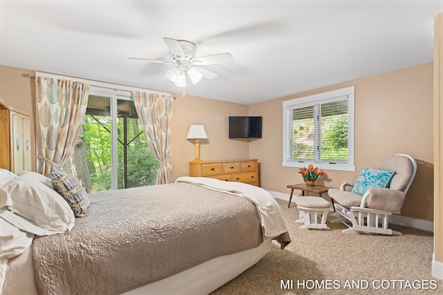 2338 Crescent Walk, Macatawa, MI 49434 - carpeted bedroom featuring baseboards and a ceiling fan