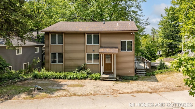 2338 Crescent Walk, Macatawa, MI 49434 - view of front facade featuring roof with shingles
