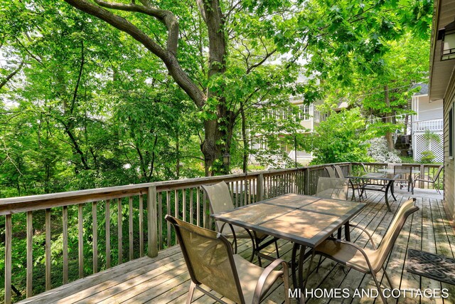 2338 Crescent Walk, Macatawa, MI 49434 - wooden terrace featuring outdoor dining area