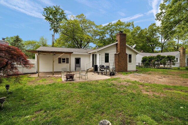 3618 Grape Ave NE, Grand Rapids, MI 49525 - back of house with a chimney, a patio area, and roof with shingles