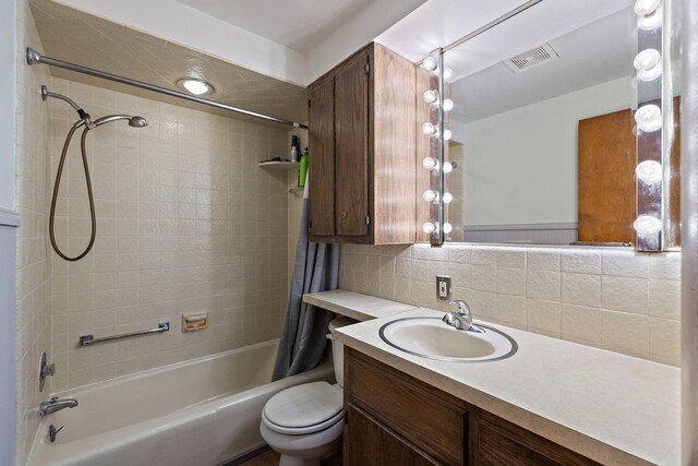 3618 Grape Ave NE, Grand Rapids, MI 49525 - full bathroom with shower / bath combo, toilet, vanity, and backsplash
