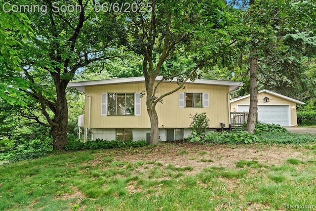 219 Beaver St, Brighton, MI 48116 - view of front of home with an outdoor structure and a detached garage