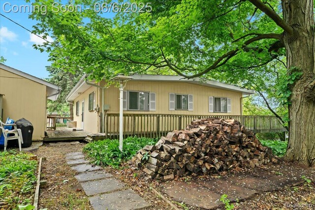 219 Beaver St, Brighton, MI 48116 - view of side of property with a wooden deck