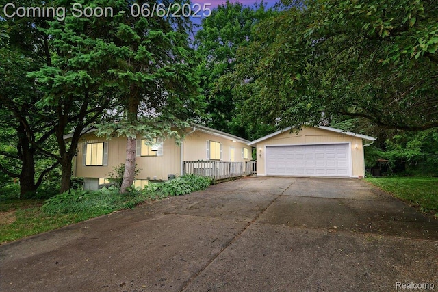 219 Beaver St, Brighton, MI 48116 - view of front of house with a garage