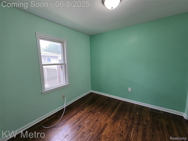 23328 Harding Ave, Hazel Park, MI 48030 - empty room featuring baseboards and dark wood-type flooring