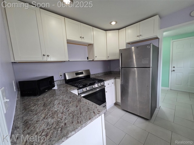23328 Harding Ave, Hazel Park, MI 48030 - kitchen featuring stainless steel appliances, dark stone counters, white cabinetry, recessed lighting, and baseboards