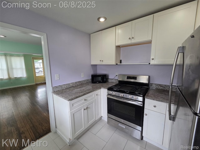 23328 Harding Ave, Hazel Park, MI 48030 - kitchen featuring appliances with stainless steel finishes, white cabinetry, dark stone countertops, open shelves, and recessed lighting