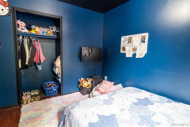 23400 Reynolds Ave, Hazel Park, MI 48030 - bedroom with a closet and wood finished floors