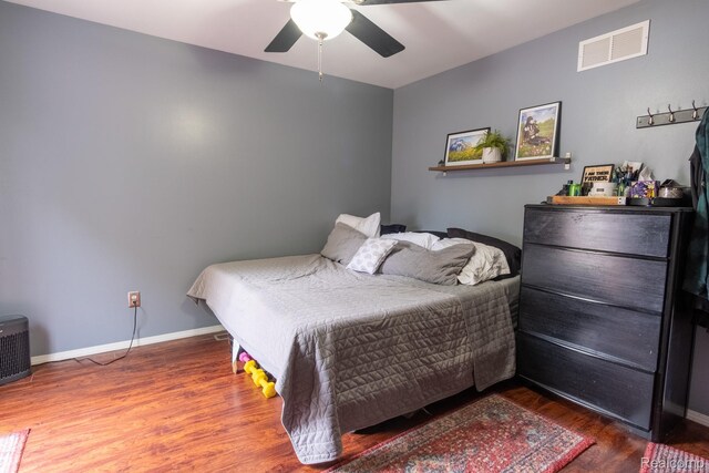 23400 Reynolds Ave, Hazel Park, MI 48030 - bedroom with wood finished floors, a ceiling fan, and baseboards