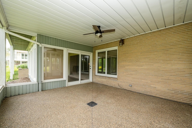 2310 Riverbend Dr, Benton Harbor, MI 49022 - unfurnished sunroom with a ceiling fan