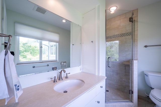 2310 Riverbend Dr, Benton Harbor, MI 49022 - full bathroom with toilet, vanity, a shower stall, and recessed lighting