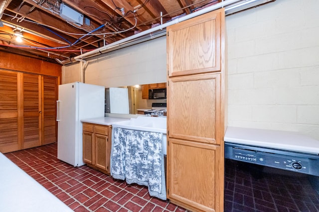 2310 Riverbend Dr, Benton Harbor, MI 49022 - kitchen featuring black appliances, brick patterned floors, light countertops, and light brown cabinets
