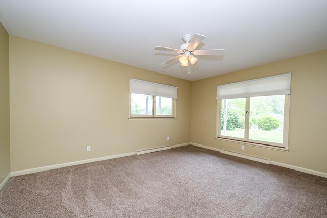 2310 Riverbend Dr, Benton Harbor, MI 49022 - carpeted empty room featuring a baseboard heating unit, baseboards, and ceiling fan