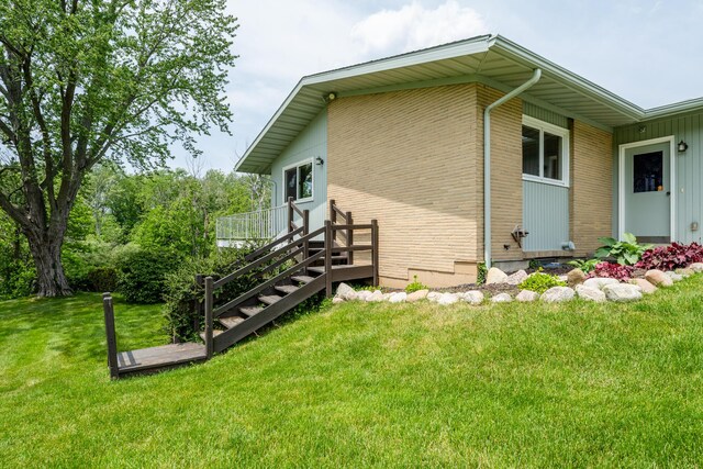 2310 Riverbend Dr, Benton Harbor, MI 49022 - view of side of home featuring a lawn and brick siding