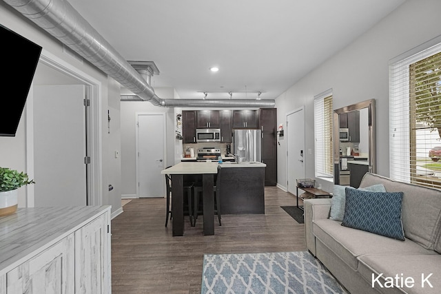 600 Douglas Ave NW Unit 612A, Grand Rapids, MI 49504 - living room with dark wood-type flooring, baseboards, track lighting, and recessed lighting