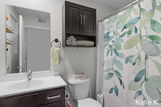 600 Douglas Ave NW Unit 612A, Grand Rapids, MI 49504 - bathroom with vanity, toilet, and a shower with curtain