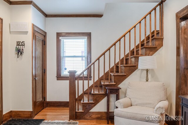 1836 Silver Ave SE, Grand Rapids, MI 49507 - stairway with wood finished floors, crown molding, and baseboards