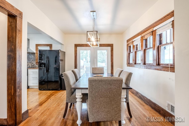 1836 Silver Ave SE, Grand Rapids, MI 49507 - dining area with light wood-style flooring and french doors
