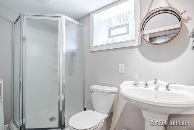1836 Silver Ave SE, Grand Rapids, MI 49507 - bathroom with a shower stall, toilet, and a sink
