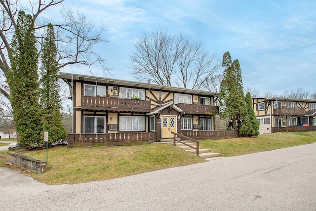 18230 Swiss Dr, Spring Lake, MI 49456 - townhome / multi-family property with a front yard and a balcony