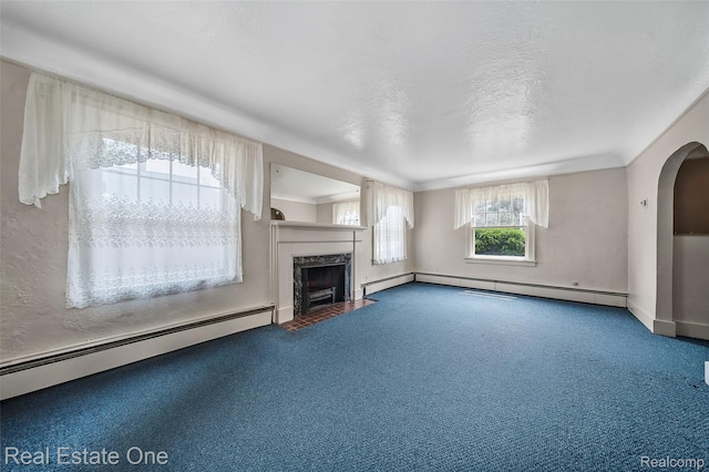 326 W Iroquois Rd, Pontiac, MI 48341 - unfurnished living room featuring baseboard heating, carpet, and a premium fireplace