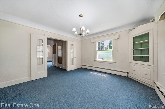 326 W Iroquois Rd, Pontiac, MI 48341 - spare room with a baseboard heating unit, dark carpet, and a chandelier