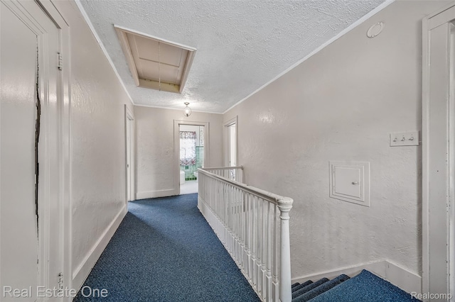 326 W Iroquois Rd, Pontiac, MI 48341 - hall with attic access, a textured ceiling, an upstairs landing, carpet flooring, and baseboards