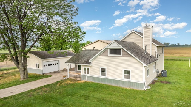 6835 Hackett Rd, Freeland, MI 48623 - view of front of home featuring roof with shingles, a front yard, a chimney, and a garage
