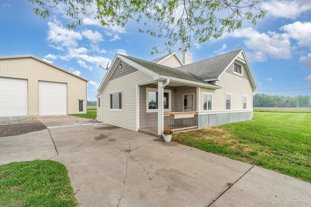 6835 Hackett Rd, Freeland, MI 48623 - view of property exterior with a yard, roof with shingles, an outdoor structure, a chimney, and a garage