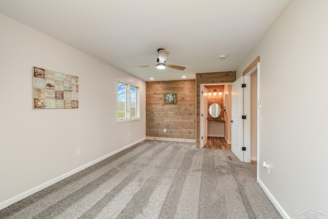 6835 Hackett Rd, Freeland, MI 48623 - empty room featuring wood walls, ceiling fan, carpet, recessed lighting, and a smoke detector