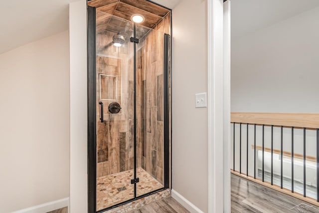 6835 Hackett Rd, Freeland, MI 48623 - bathroom with a shower stall and wood finished floors